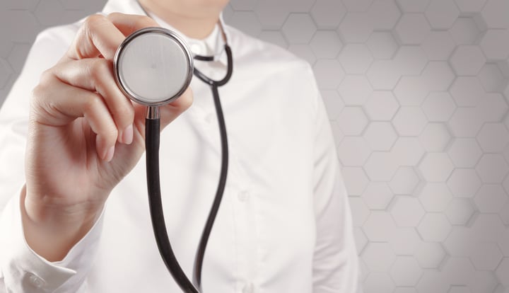 doctor with a stethoscope in hand
