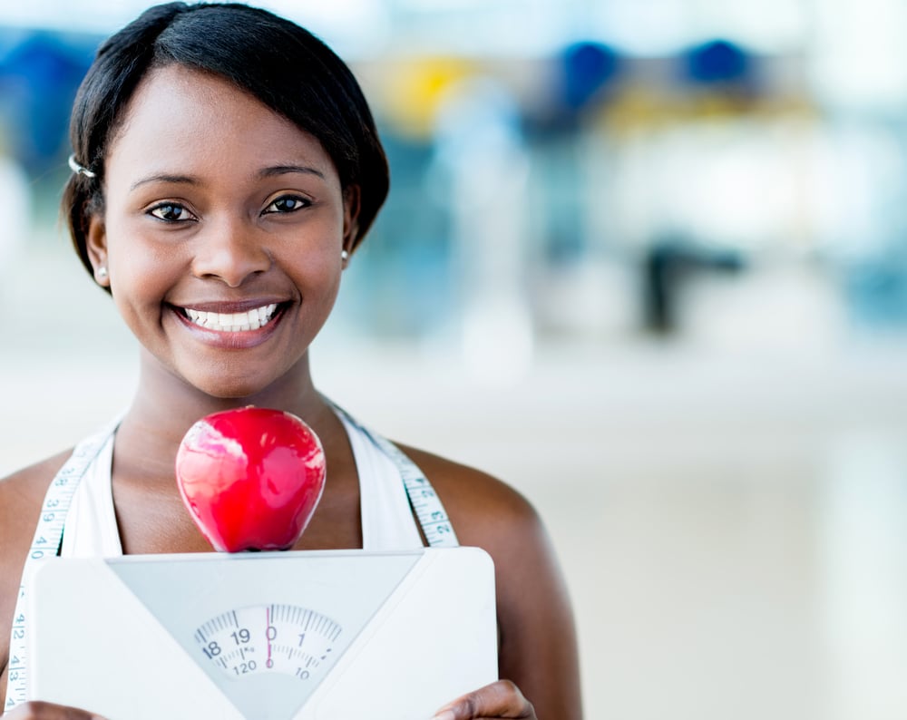healthy eating woman holding scale and an apple
